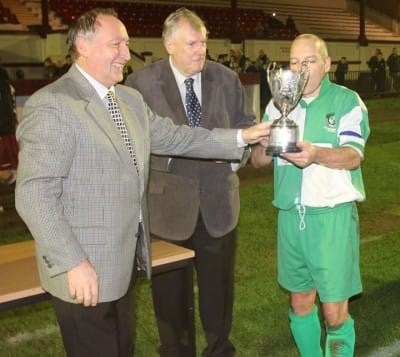 Captain Mike Beaumont receiving the trophy