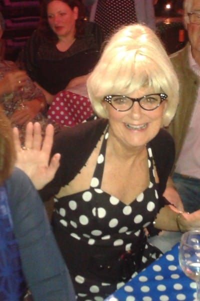 Liz Salmon with beehive and period glasses