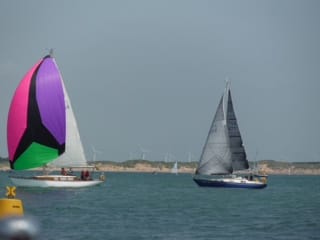 Helena An with her colourful asymmetric spinaker leads Mystic Sky