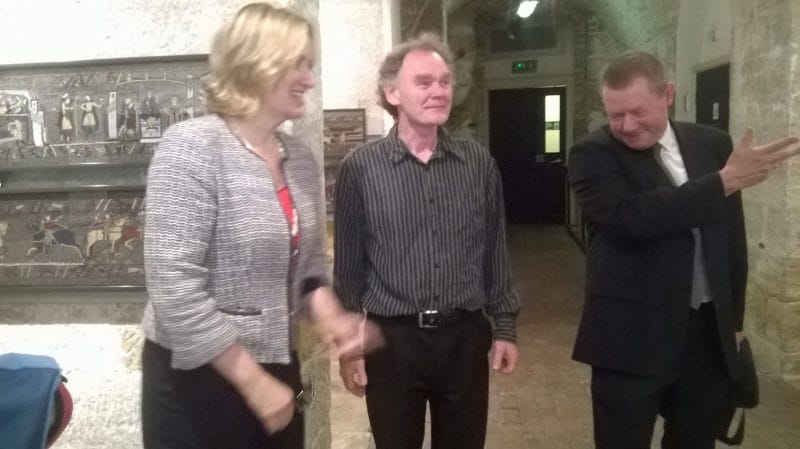 Amber Rudd (Rye and Hastings MP) meets creator of the mosaic panels, Michael Linton, a recreation of the Bayeux Tapestry, introduced by Kevin Bourman on the right 