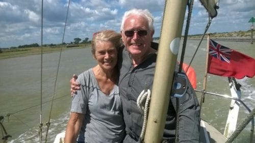 Sailing doesn't help the hairdo but it certainly enhances the mood. Me with Tony, the skipper