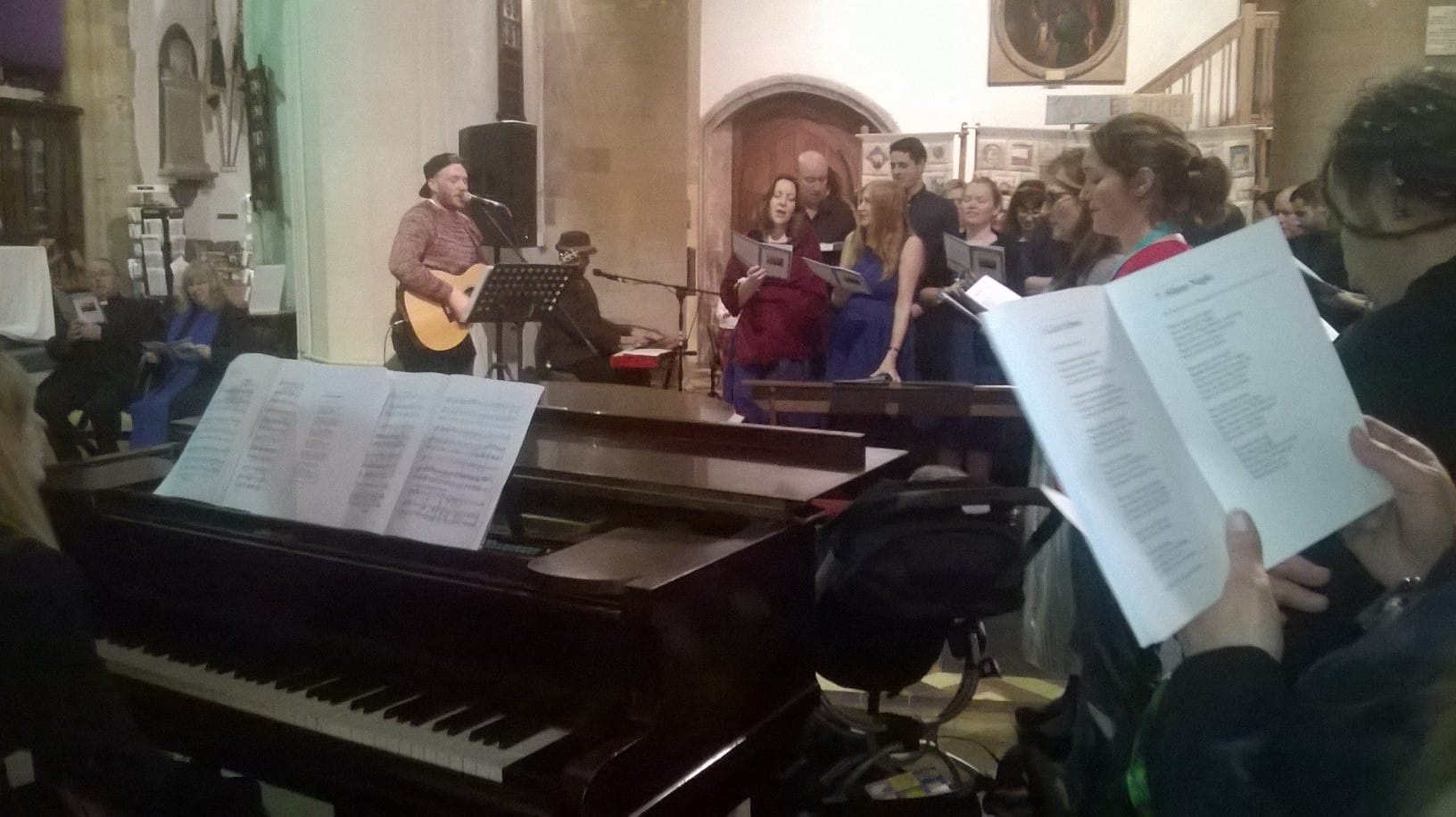 Sam Carver leads us all for the wonderful carol ensemble